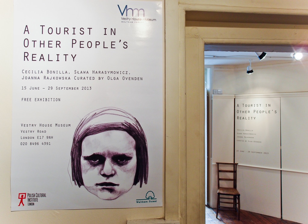 A poster of the exhibition "A tourist in other people's reality" exhibition by Cecilia Bonilla, Sława Harasymowicz and Joanna Rajkowska. Curated by Olga Ovenden,Vestry House Museum, August 2013, Photo Slawek Kozdras for Contemporary Lynx