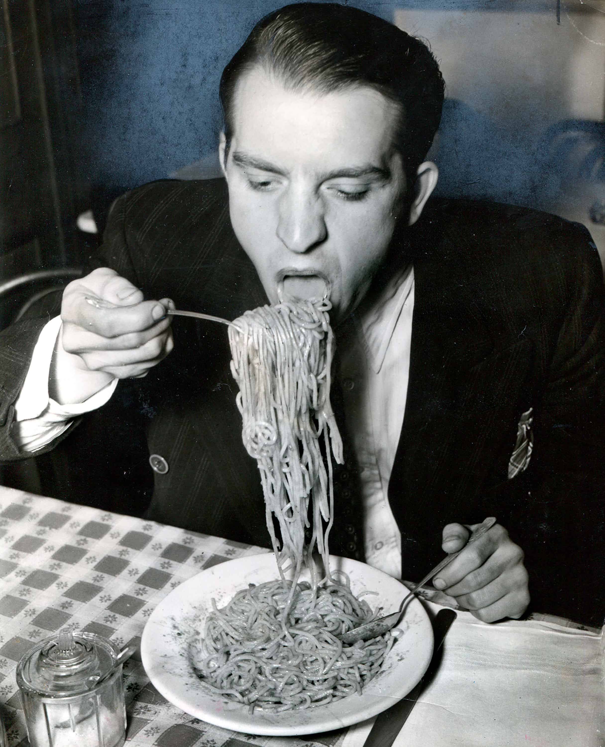 Weegee, Phillip J. Stazzone is on WPA and enjoys his favorite food as he’s heard that the Army doesn’t go in very strong for serving spaghetti, 1940, Gelatin-Silver Print © Weegee/International Center of Photography. Courtesy Ira and Suzanne Richer