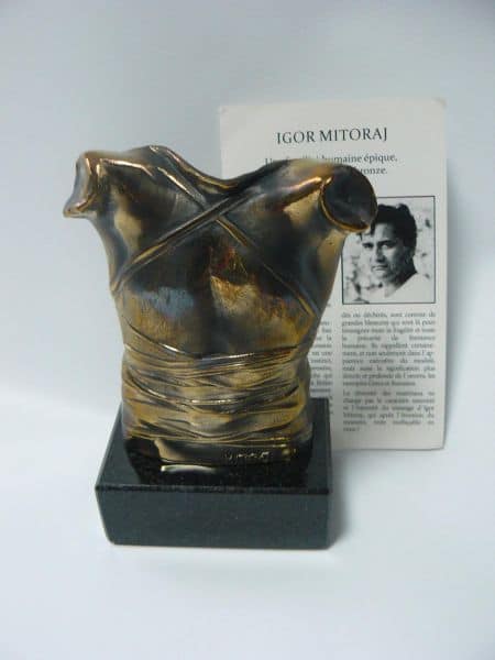 Sculpture by Igor Mitoraj, Breastplate – patinated bronze on marble plinth, 11 cm x 8 cm, signed MITORAJ at the bottom of the torso.