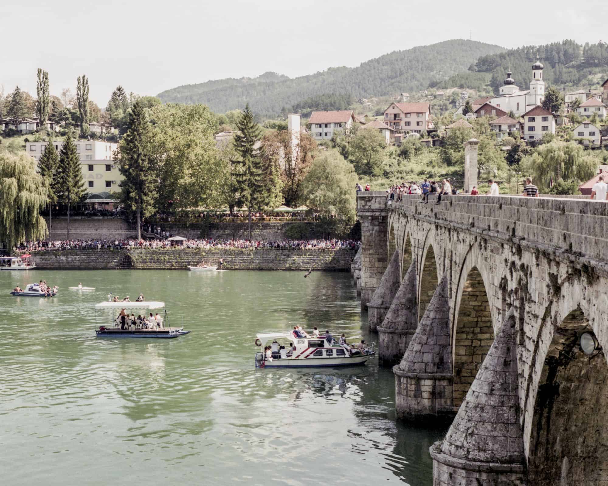 Paweł Starzec, The Bridge on Drina, Visegrad, former execution ground. Water jumping contest, from the series: Makeshift, courtesy of the artist