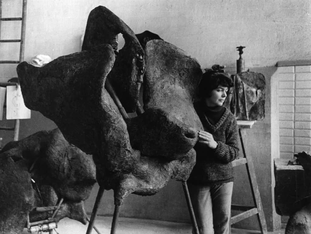 Alina Szapocznikow in her Père-Lachaise studio, Paris, FR with her work ‘Sculpture avec une roue tournante (Sculpture with a Rotating Wheel),’ 1963-1964 ca. 1963, Photographer: Władysław Sławny