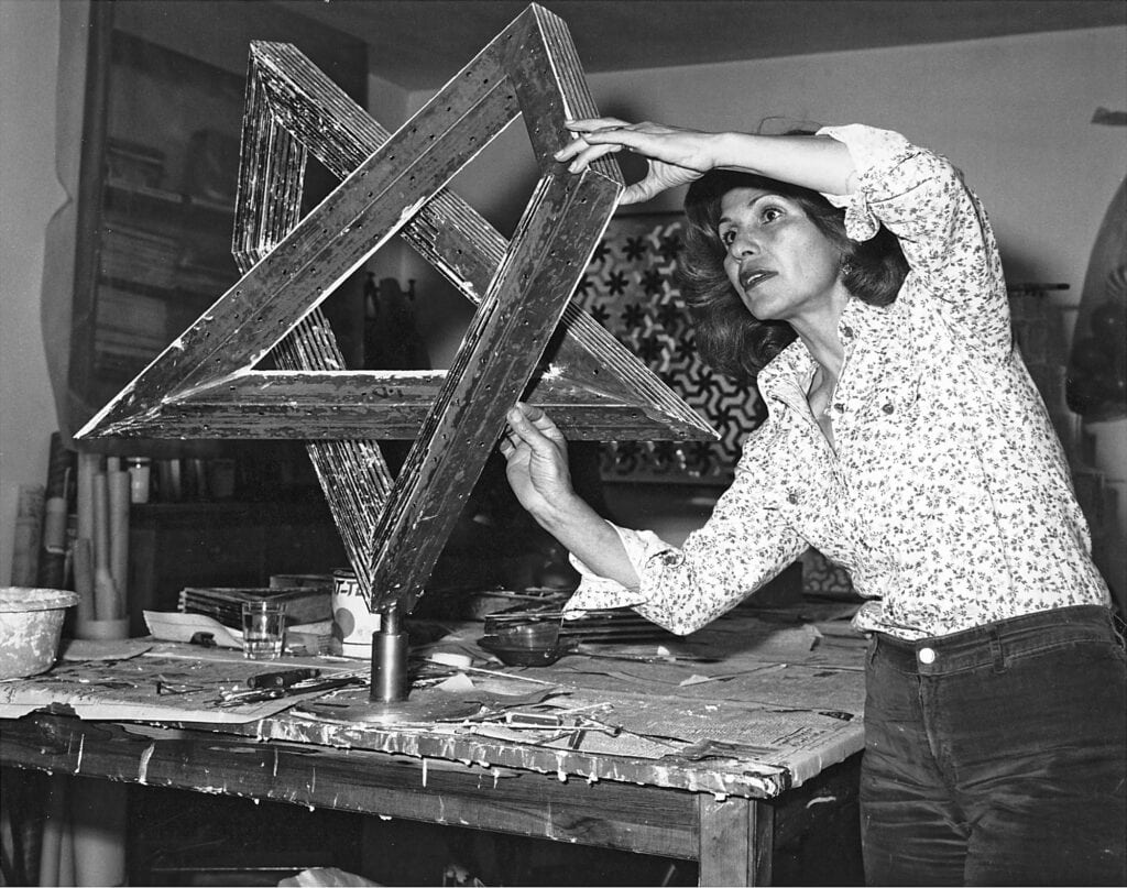 Monir Shahroudy Farmanfarmaian in her studio, working on Heptagon Star, Tehran, 1975, Estate of Monir Shahroudy Farmanfarmaian