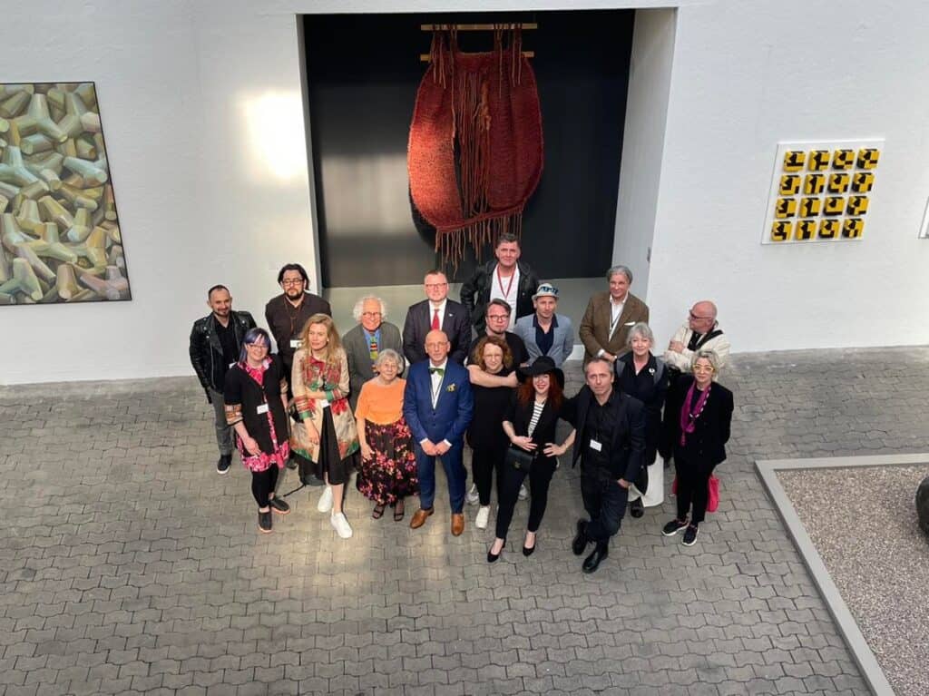 Polish artists at the opening. Left back: Michał Jackowski, Sebastian Krok, Wojciech Antoni Sobczyński, Paweł Jaworski (General Consul RP in Hamburg), Janusz Pretki (NordArt Team), Tomasz Kopcewicz, Jan de Weryha- Wysoczański, Left: Janina Wyronova, Julita Malinowska , Krystyna Tomaszewska (Lubomir Tomaszewski’s wife), Lukasz Patelczyk with Karolina Leśnik – Patelczyk, Agata Tuszyńska, Paweł Wocial, Dorota Kuczma, Wacław Kuczma and Carolina Khouri, Photo: Sylwia Płonka