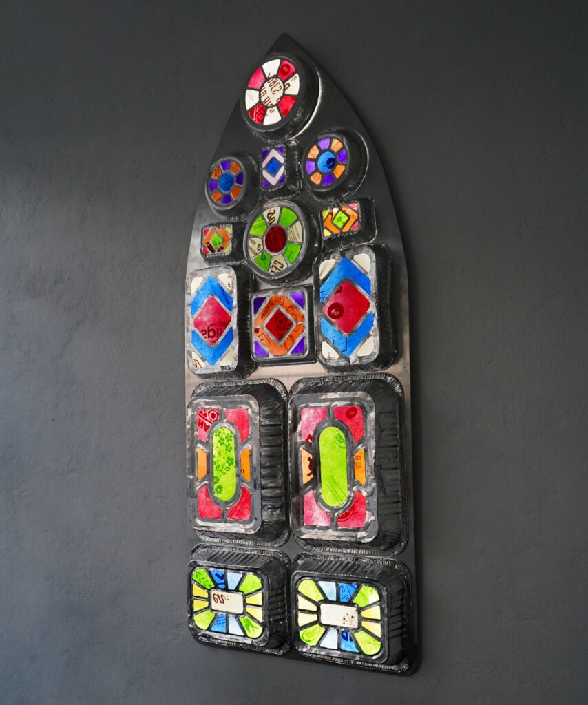 Ty Locke, Rituals (Gothic), 2025. Alumnium food containers, shopping bags, LED lights, alumnium backing. 157 x 67 x 9 cm. Courtesy of the Artist and Copperfield, London. Copyright the Artist_