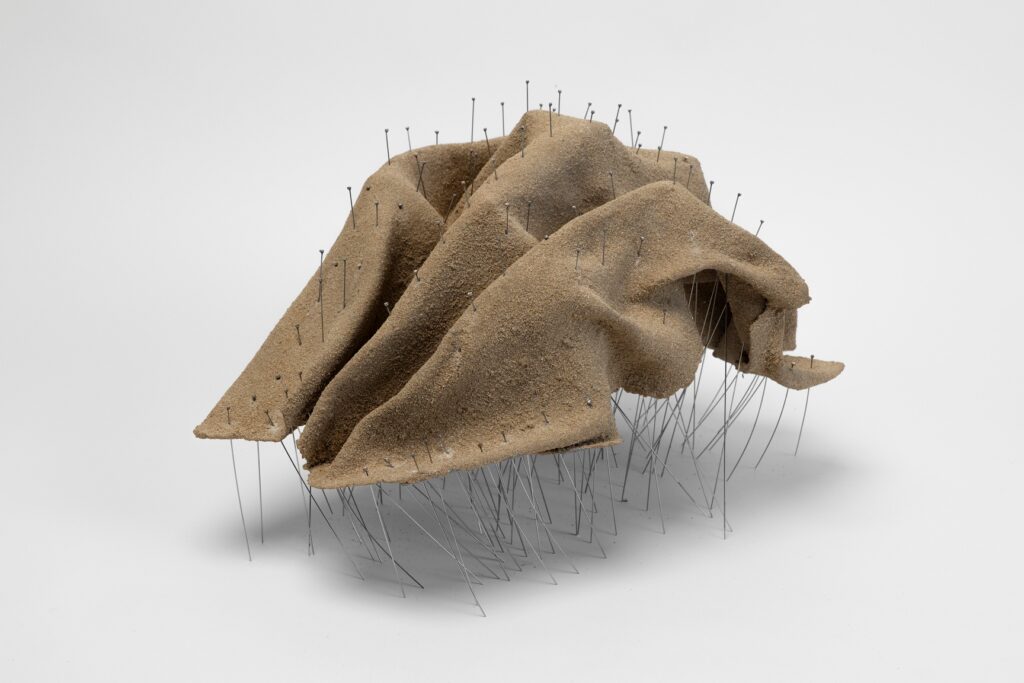 Talin Hazbar, Scrunch, 2025. Sand, fiberglass, pins, 60x50x30 cm. Courtesy of AWL and the artist. Photo credit_ Ismail Noor at Seeing Things.