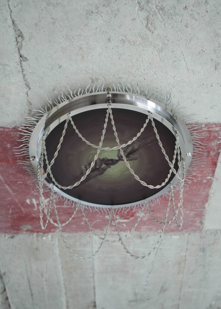 Natalie Sasi Organ, Water your Seeds, 2025, oil on canvas in stainless steel frame with chainmail, 65 x 65 x 10 cm. Courtesy of the artist