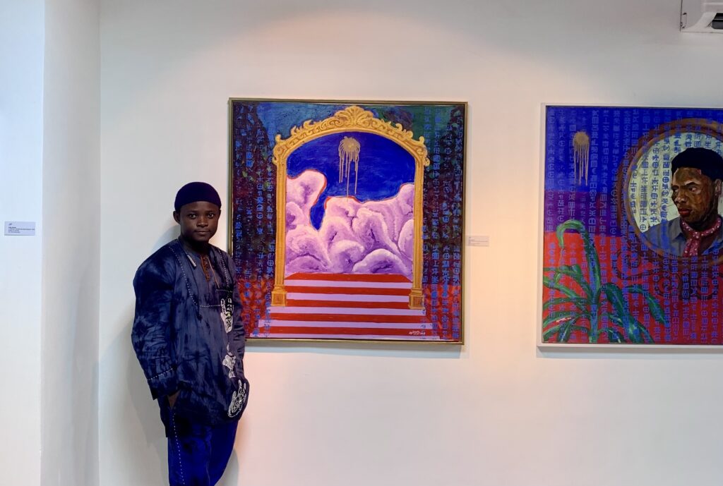 Paul Ayihawu at the Ilé Adua Exhibition. Courtesy of Paul Ayihawu